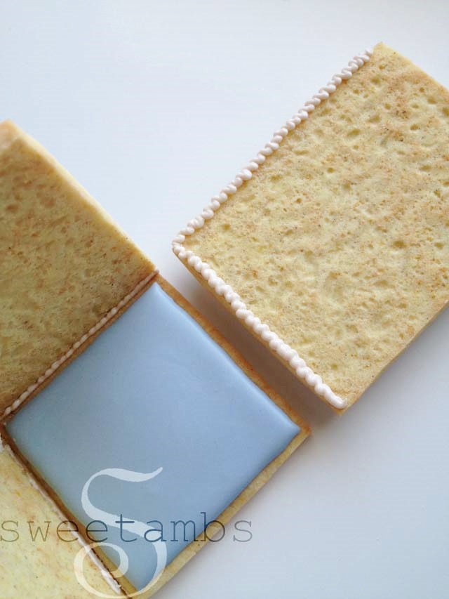 Icing applied to the bottom and side of the third wall of the cookie box