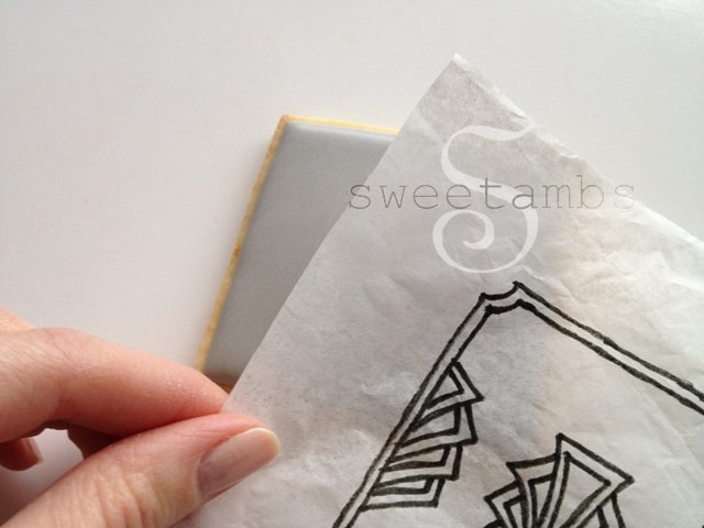 place the tissue paper with the design over the cookie