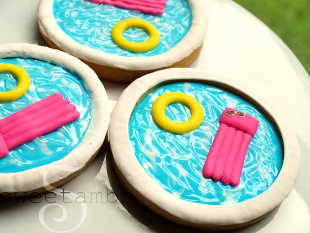 cookies decorated to look like swimming pools with pool floaties
