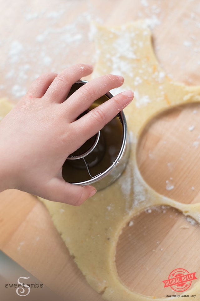 Toddler cutting cookie dough