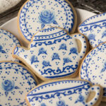 A set of cookies decorated to look like a Delft pottery tea set.