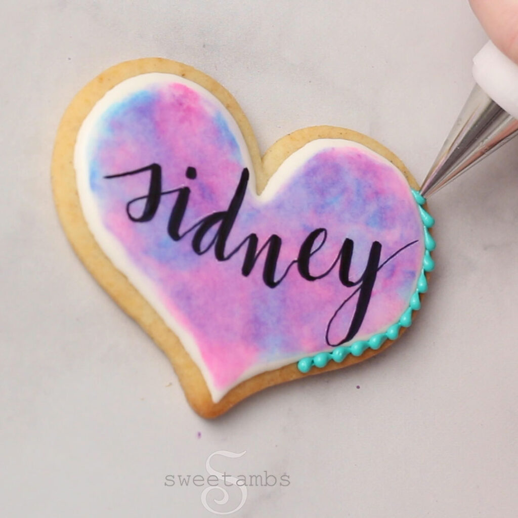 pipe borders with slightly thinned stiff consistency royal icing and a decorating tip 3