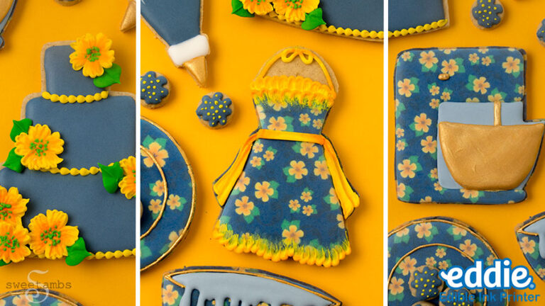 A collage of 3 photos showing a set of cookies decorated to look like a tiered cake, a piping bag, tiny cookies, an apron, and a stand mixer. The cookies are decorated with golden yellow flowers and dark blue icing. They are on a golden yellow background.