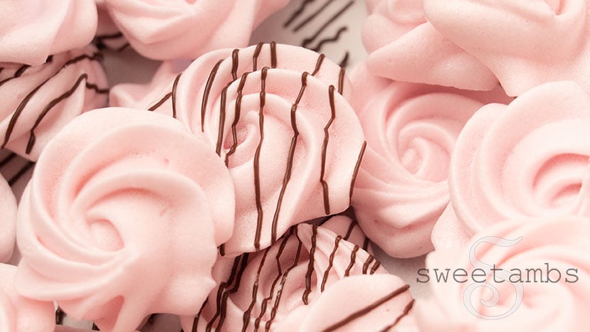 Raspberry meringue cookies drizzled with chocolate