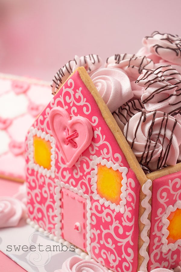 A Valentine's Day gingerbread house filled with meringue cookies