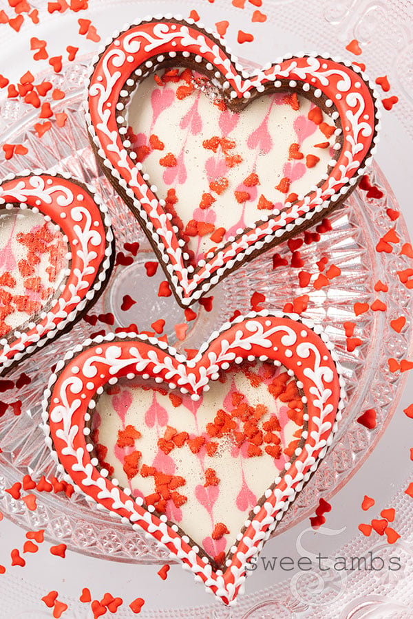 Heart shaped cookies with a clear sugar window showing sprinkles inside