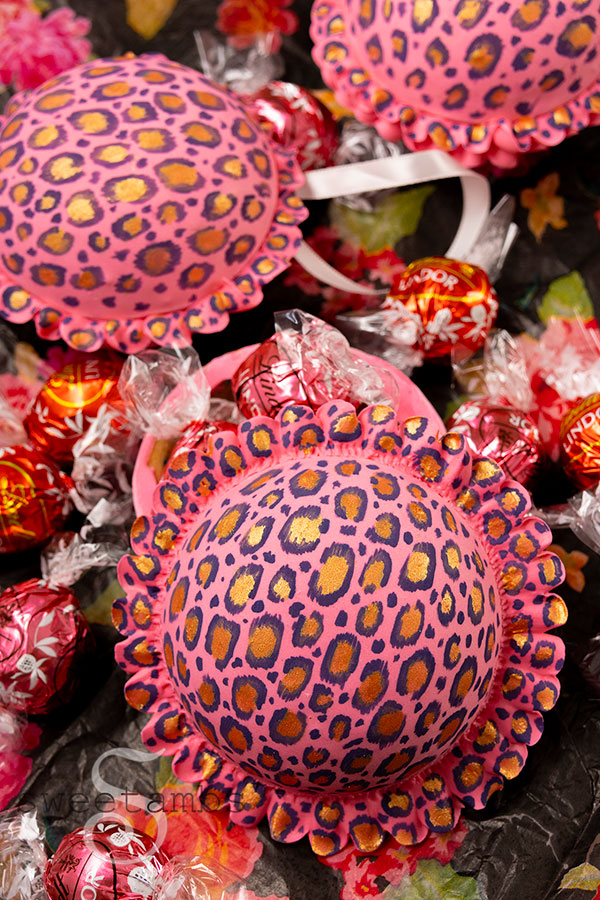 A spherical cookie decorated with a leopard print design and ruffles